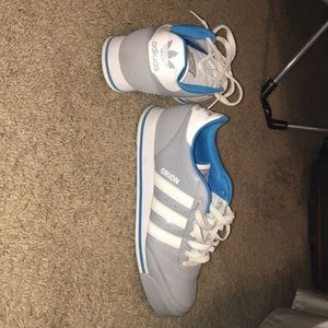 low top blue and gray adidas sneakers